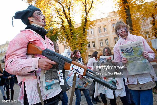 People take part at the &quot;Zombie walk&quot;,dedicated to the Halloween,in the center of Kiev,Ukraine,31 October,2015.