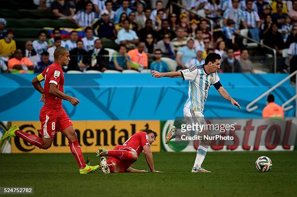 Lionel Messi carries the ball trough the midfiel to pass to Angel Di Maria socre for Argentina, at the extra Time of the match, for the Round of 16...