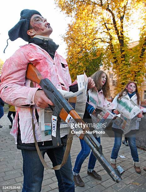 People take part at the &quot;Zombie walk&quot;,dedicated to the Halloween,in the center of Kiev,Ukraine,31 October,2015.