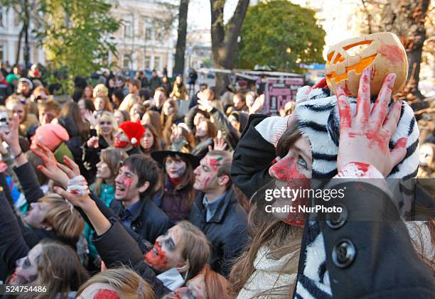 People take part at a &quot;Zombie walk&quot;,dedicated to the Halloween,in the center of Kiev,Ukraine,31 October,2015.