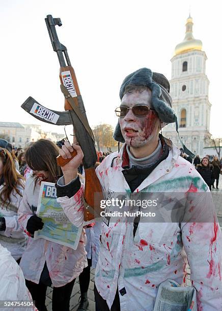 People take part at a &quot;Zombie walk&quot;,dedicated to the Halloween,in the center of Kiev,Ukraine,31 October,2015.