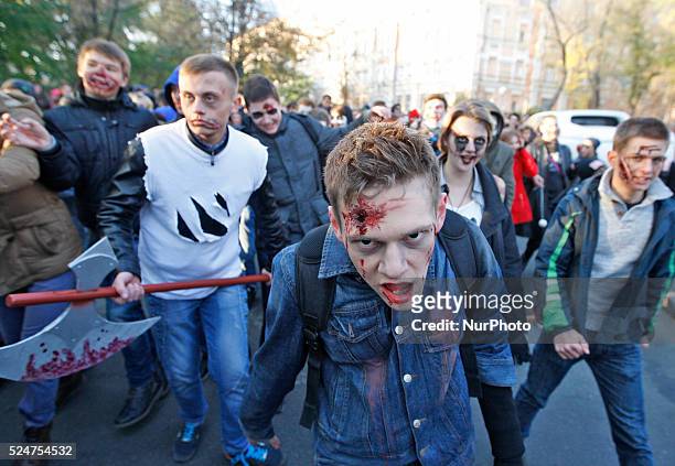 People take part at a &quot;Zombie walk&quot;,dedicated to the Halloween,in the center of Kiev,Ukraine,31 October,2015.