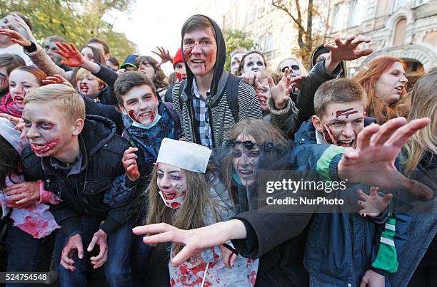 People take part at a &quot;Zombie walk&quot;,dedicated to the Halloween,in the center of Kiev,Ukraine,31 October,2015.