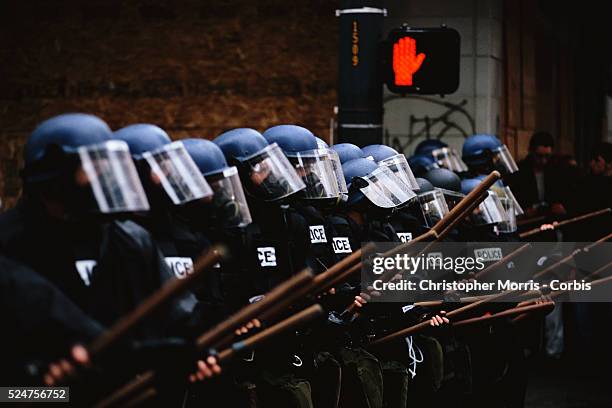 Members of the Seattle Police in riot gear line up to face protesters during the World Trade Organization's 1999 conference in Seattle. What started...
