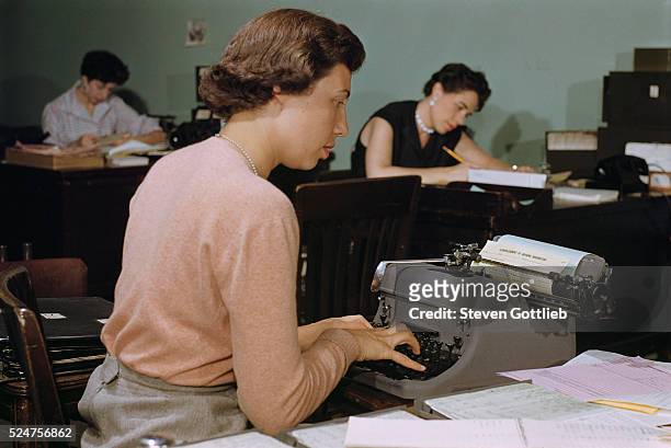 Secretary Working at Typewriter