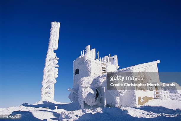 An observatory is covered with heavy snow atop Mount Washington in the White Mountains of New Hampshire.