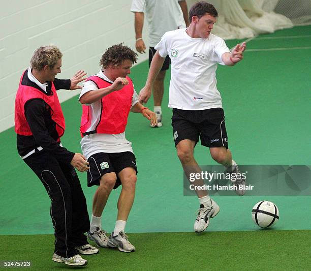 Brendon McCullum, James Marshall and Lou Vincent of New Zealand in action during a game of soccer during training at Eden Park on March 25, 2005 in...