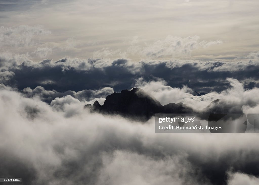 Mountain emerging from a sea of clouds