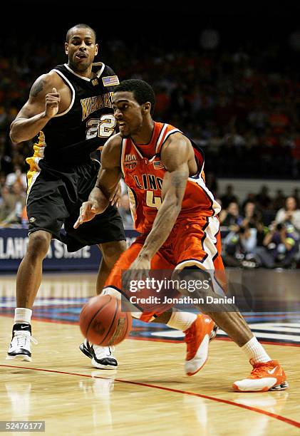 Luther Head of the Illinois Fighting Illini drives past Ed McCants of the Wisconsin-Milwaukee Panthers in game one of the Chicago Regional in the...