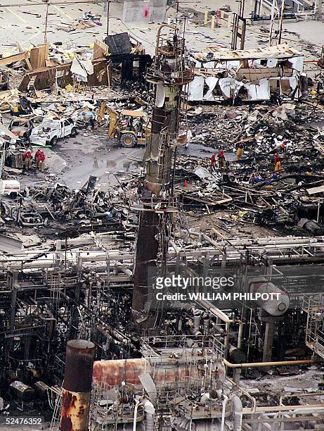 Workers sift through debris at the BP facility in Texas City 55 kilometers south of Houston, 24 March 2005, after an explosion. The death toll from...