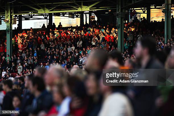 Fans sing the national anthem before the Boston Red Sox take on the Tampa Bay Rays at Fenway Park on April 19, 2016 in Boston, Massachusetts.