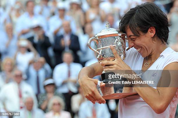 Francesca Schiavone of Italy celebrates with the trophy after winning the women's singles final match between Francesca Schiavone of Italy and...