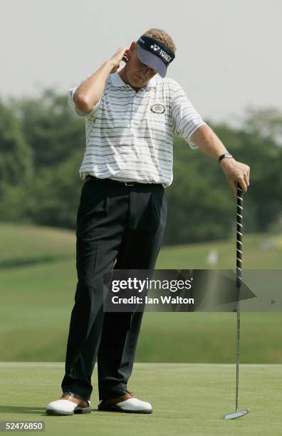 Dejected Colin Montgomerie of Scotland stands on the 4th hole during the second round of the Indonesia Open 2005 at the Cengkareng Golf Club on March...