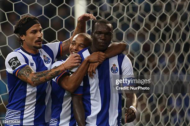 Porto's Cameroonian forward Vincent Aboubakar celebrates after scoring goal with teammates Porto's Algerian forward Yacine Brahimi and Porto's Itaian...