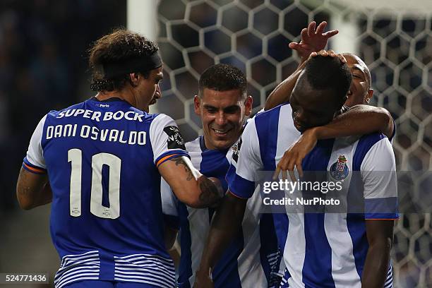 Porto's Cameroonian forward Vincent Aboubakar celebrates after scoring goal with teammates Porto's Uruguayan defender Maxi Pereira and Porto's Itaian...