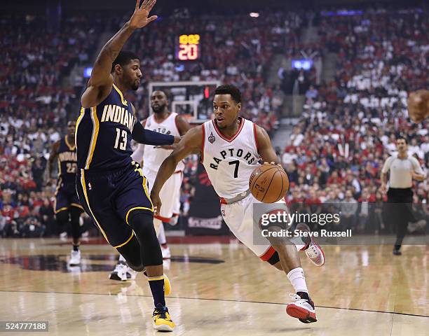 Kyle Lowry sprints past Paul George as the Toronto Raptors beat Indiana Pacers in game five 102-99 in their first round NBA playoff series at the Air...