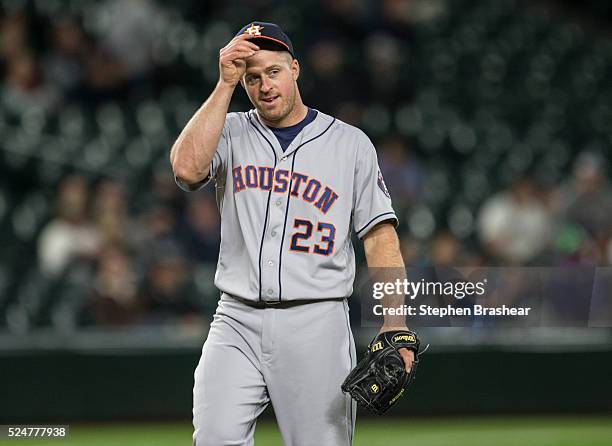 Erik Kratz of the Houston Astros, whose position is catcher, reacts while pitching eighth inning of a game against the Seattle Mariners at Safeco...