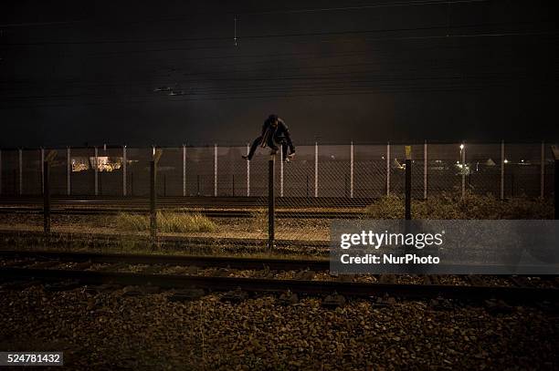 Refugees try, how each night, to cross the border to get to England via the railway line from the northern French city of Calais on November 7, 2015....