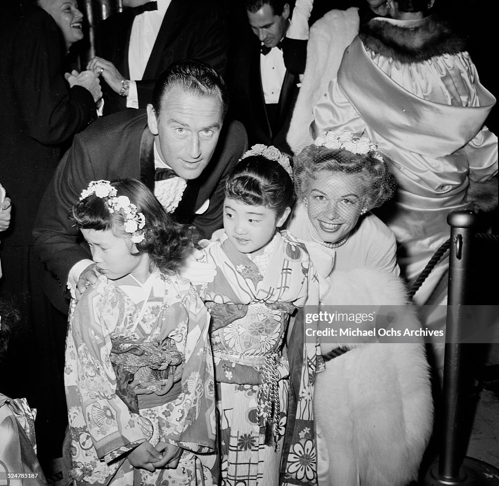 Actress Vera-Ellen and husband Victor Rothschild pose with two little