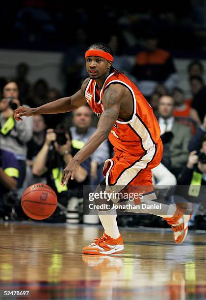 Dee Brown of the Illinois Fighting Illini brings the ball up court against the Wisconsin-Milwaukee Panthers in game one of the Chicago Regional in...