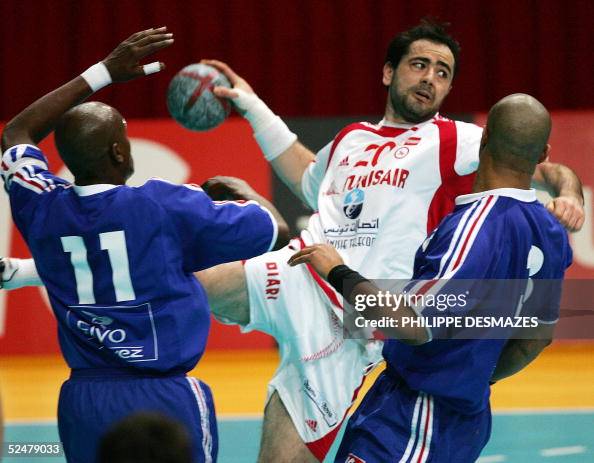 Tunisian s Heykel Mgannem Tries To Score In Front Of France s Olivier tunisian-s-heykel-mgannem-tries-to-score-in-front-of-france-s-olivier