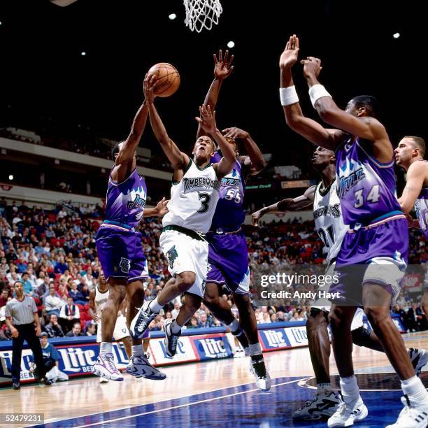 Stephon Marbury of the Minnesota Timberwolves drives to the basket for a layup against the Utah Jazz during an NBA game at the Target Center on...