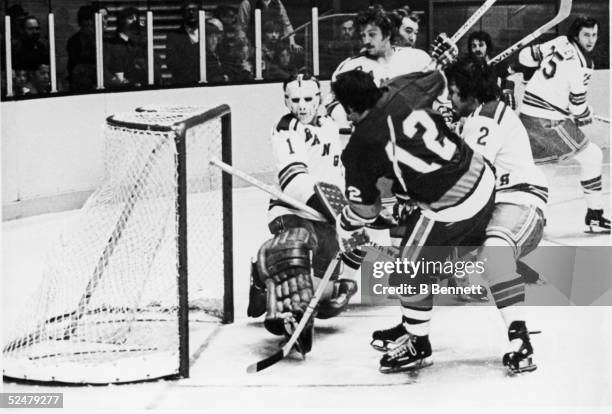 Canadian pro hockey player J.P. Parise of the New York Islanders scores a goal in overtime to defeat the rival New York Rangers in the 1975 playoffs...