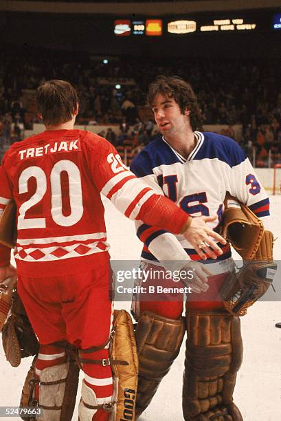 American hockey player Jim Craig shakes hands with fellow goalie CCCP player Vladislav Tretiak after the Soviet team beat Team USA in an exhibition...