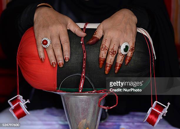 An Emirati woman with a traditional henna hand decorations. Jebel Hafeet, Abu Dhabi, UAE. 10 October 2015.