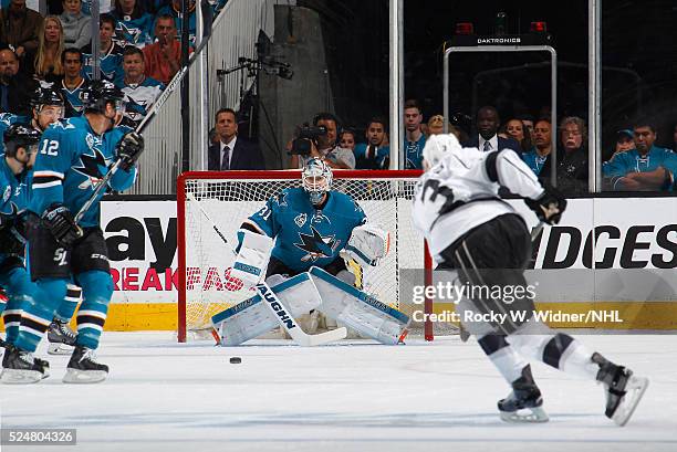 Martin Jones of the San Jose Sharks protects the net against a shot from Brayden McNabb of the Los Angeles Kings in Game Four of the Western...