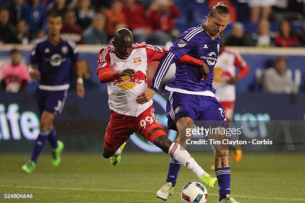 Bradley Wright-Phillips, #99 of New York Red Bulls is challenged by Brek Shea of Orlando City FC during the New York Red Bulls Vs Orlando City MLS...