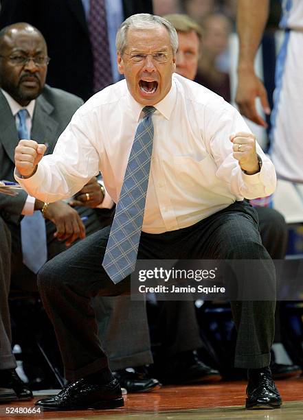 Head coach Roy Williams of the North Carolina Tar Heels shouts from the bench during their regional semi-final game against the Villanova Wildcats on...