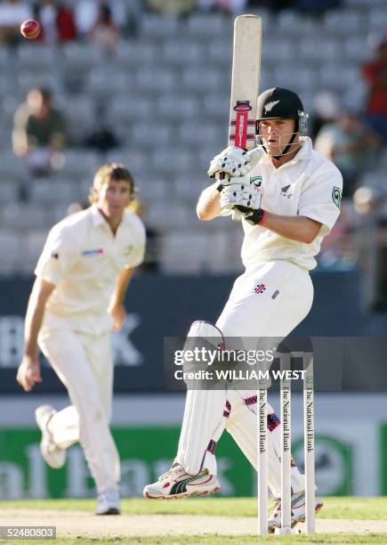 New Zealand batsman Lou Vincent attempts to hook a delivery from Australian paceman Glenn McGrath looks on during the first day of the third Test...