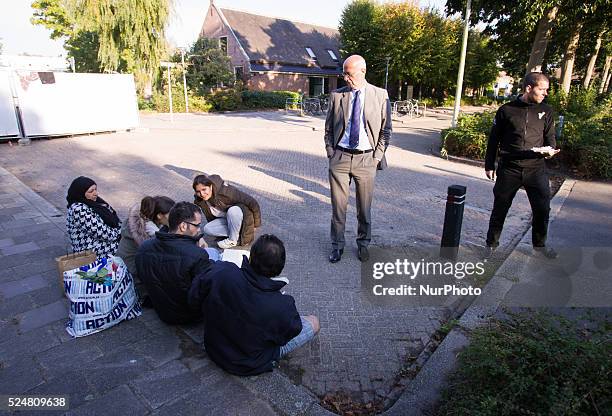 Mayor Jeroen Staatsen is seen speaking with refugees on Sunday. On Friday night three buses with around 125 refugees arrived from the central...