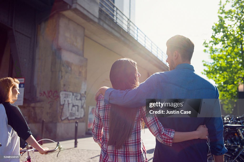 Group of young people walking in a sunny street