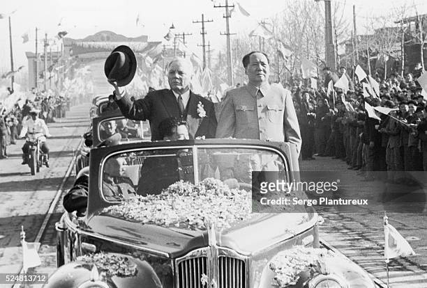 Mao and Kliment Yefremovich Voroshilov in a parade car.