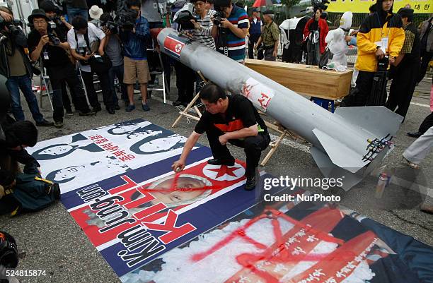 January 6, 2016 - South Korea, Seoul : Protesters carried a mock North Korean missile during a protest denouncing North Korea's missile test. North...