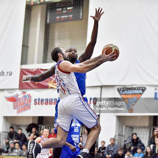 Pankracije Barac of Steaua CSM EximBank Bucharest and Callistus Alexander Eziukwu of CS Energia Targu Jiu in action during the LNBM - Men's National...