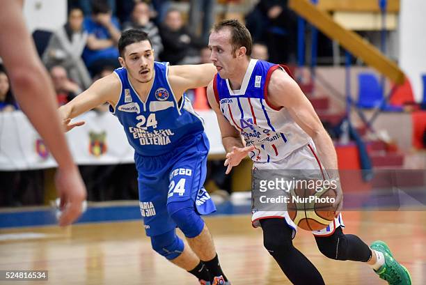 Marko Marinovic of Steaua CSM EximBank Bucharest and Baris Aktas of CS Energia Targu Jiu in action during the LNBM - Men's National Basketball League...