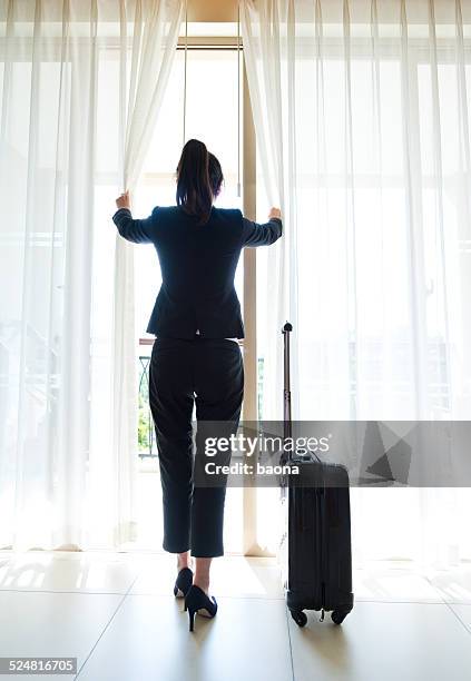 business travel - woman walking out door silhouette stock pictures, royalty-free photos & images