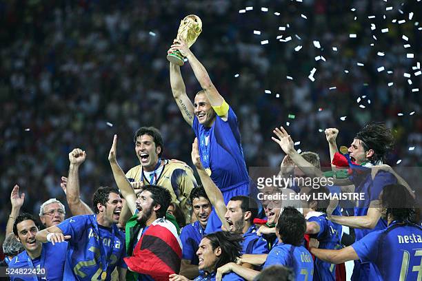 Italian players celebrate with the winner's trophy after the final of the 2006 FIFA World Cup between Italy and France.