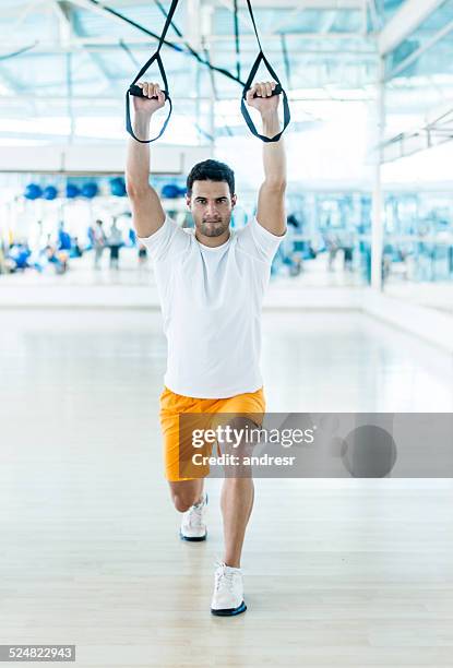 man at the gym - suspension training stock pictures, royalty-free photos & images