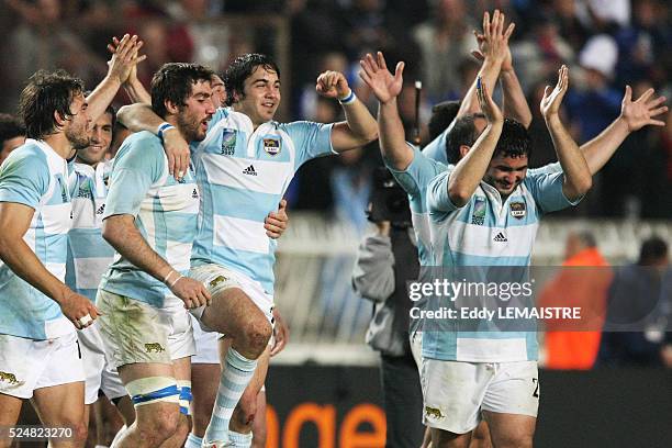 Argentina players celebrate winning the IRB World Cup rugby bronze final between France and Argentina.