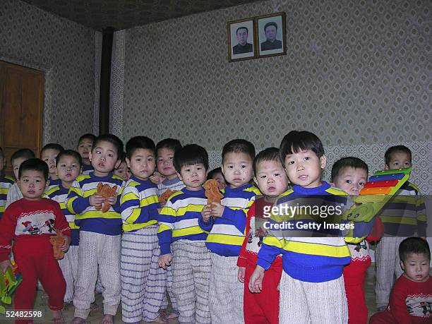 In this handout photo from the World Food Programme, North Korean infants are seen at a government run orphanage March 24, 2005 in Huichon City in...