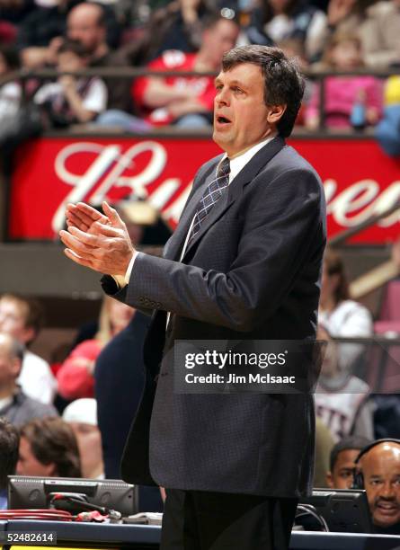 Head coach Kevin McHale of the Minnesota Timberwolves applaudes his teams effort during their game against the New Jersey Nets on March 26, 2005 at...