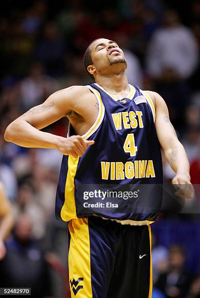 Tyronne Sally of the West Virginia Mountaineers reacts after fouling out in overtime against the Louisville Cardinals during the Elite 8 game of the...