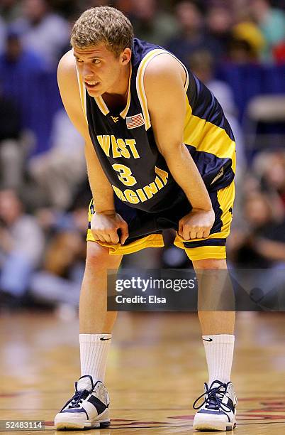 Patrick Beilein of the West Virginia Mountaineers looks on in overtime of the game against the Louisville Cardinals during the Elite 8 game of the...