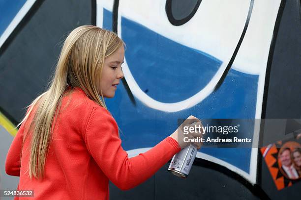 Princess Ariane of The Netherlands sprays graffiti during King's Day , the celebration of the birthday of the Dutch King, on April 27, 2016 in...