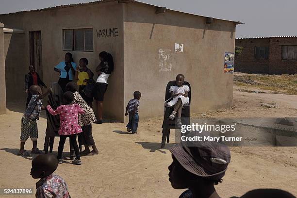 Children play on chairs after a Baptist church service in the developing township of Waterfalls, Zimbabwe on October 11 2015. Churches and religious...