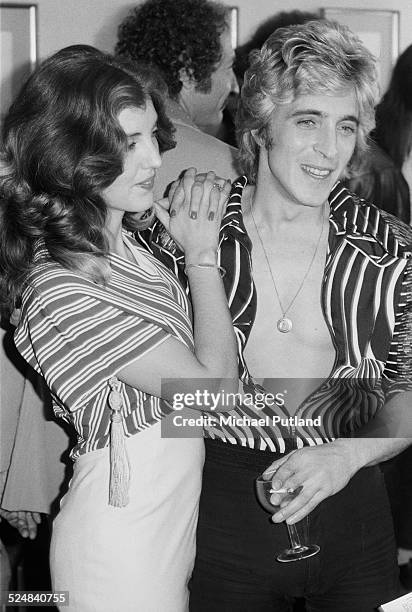 English guitarist Mick Ronson of English rock group Mott the Hoople, with his future wife Suzi Fussey, London, 19th September 1974.